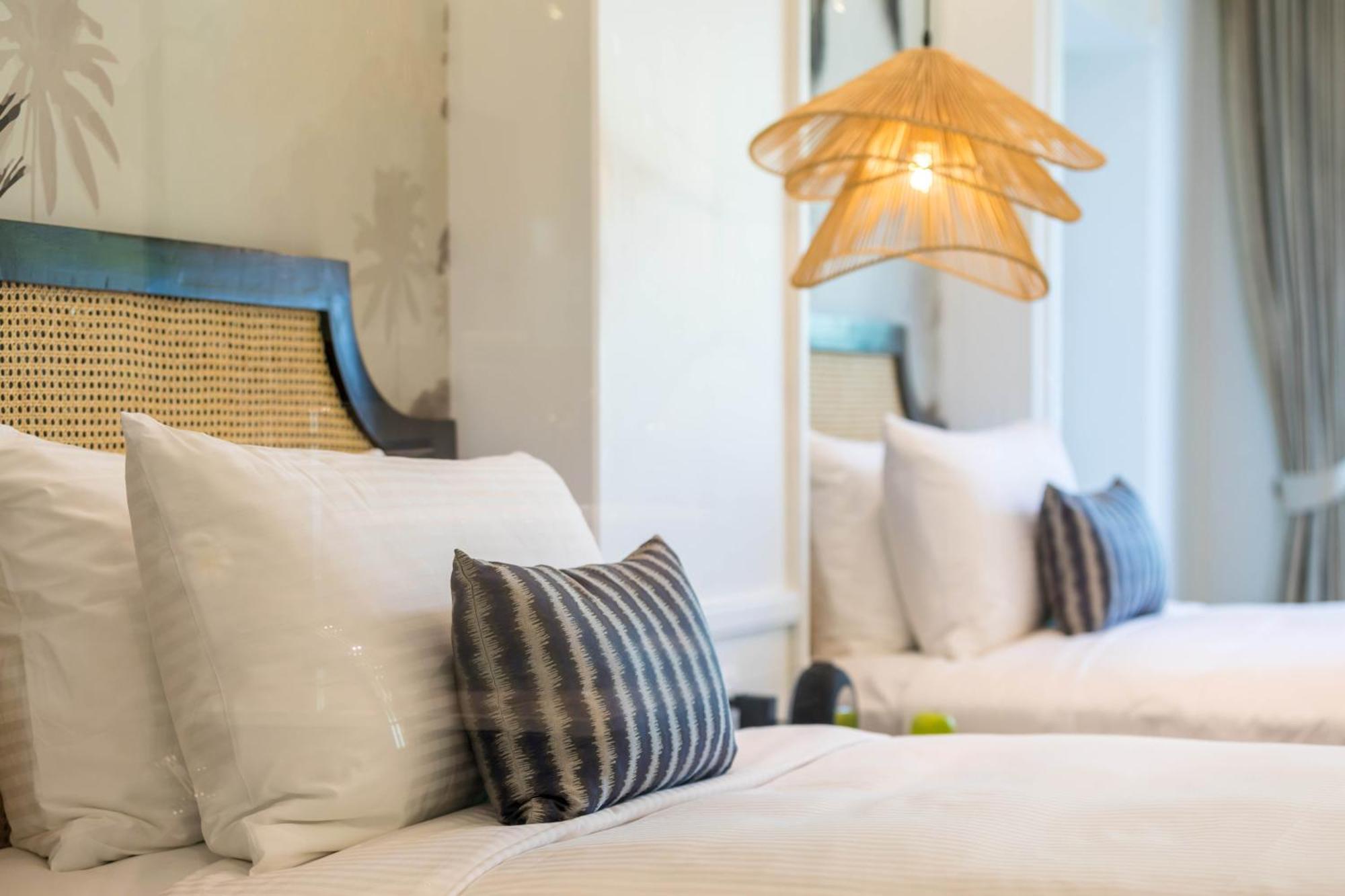 Outrigger Koh Samui Beach Resort - Sha Extra Plus Lamai Beach (Koh Samui) Quarto foto A bed with cushions